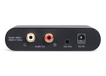 Black sound masking generator with audio and aux outputs, labeled ports, and a DC input. Model SMG1.